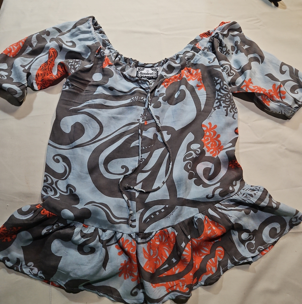 Manuhealii Light Blue Tunic with Orange and Gray Swirls